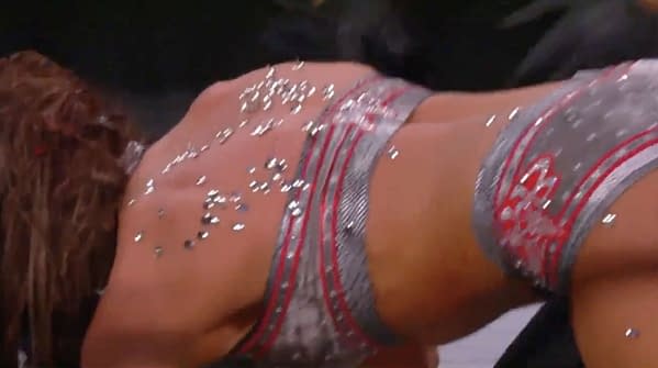 Britt Baker's back is covered in thumbtacks during a hardcore match with Thunder Rosa at AEW Dynamite's St. Patrick's Day Slam