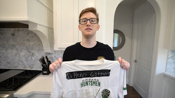 Seth "Scump" Abner proudly holding his Real Heroes jersey, courtesy of Activison.