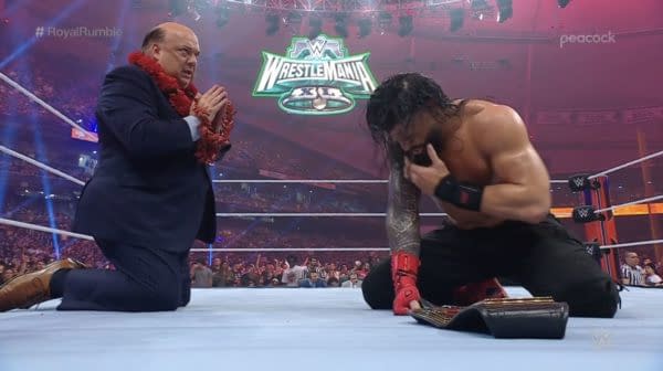 Roman Reigns sits victorious with Paul Heyman at the WWE Royal Rumble