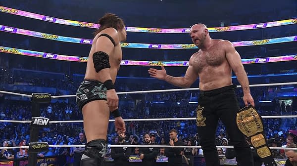 Jon Moxley extends a handshake to Konosuke Takeshita after defeating him to retain the Continental Championship during AEW Revolution, with cheering fans visible in the background.
