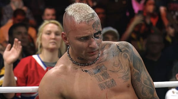 Darby Allin, a professional wrestler with distinctive tattoos and a mohawk hairstyle, appears exhausted after a tough win against Andrade El Idolo. Blood is visible on his lip, and fans can be seen cheering in the background.