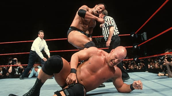 The Rock laying the smackdown on "Stone Cold" Steve Austin at WrestleMania XV, courtesy of WWE.
