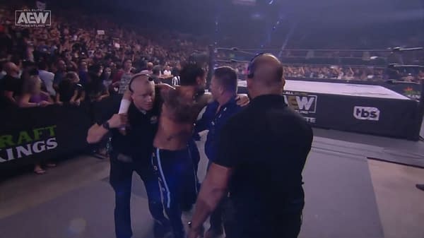 CM Punk is helped backstage after losing the AEW World Championship to Jon Moxley