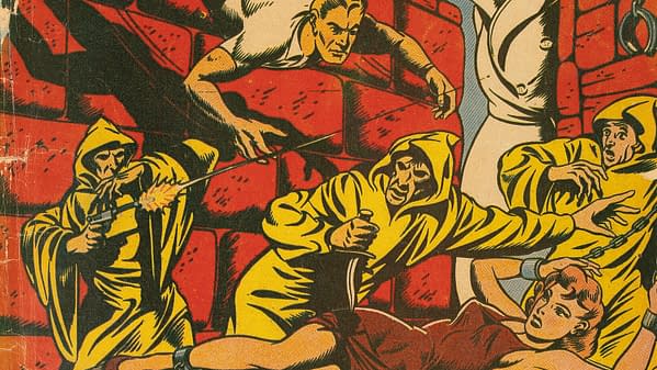 A vintage comic cover features a scene of suspense, showing characters in yellow hooded robes, one aiming a gun, while others appear startled or in distress. The dramatic backdrop includes stone walls, emphasizing the tension in the scene.