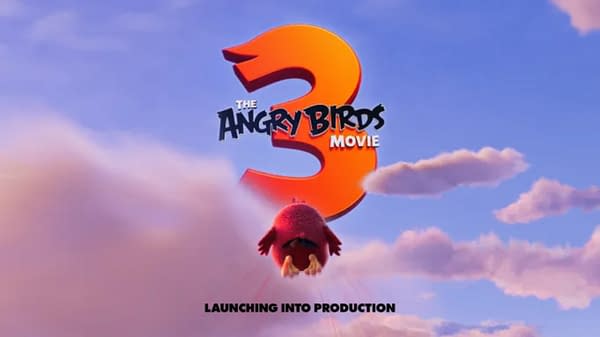 A promotional poster for 'The Angry Birds Movie 3,' featuring the large number 3 in orange against a blue sky with clouds, as a red bird takes flight below. The text 'LAUNCHING INTO PRODUCTION' is displayed at the bottom.