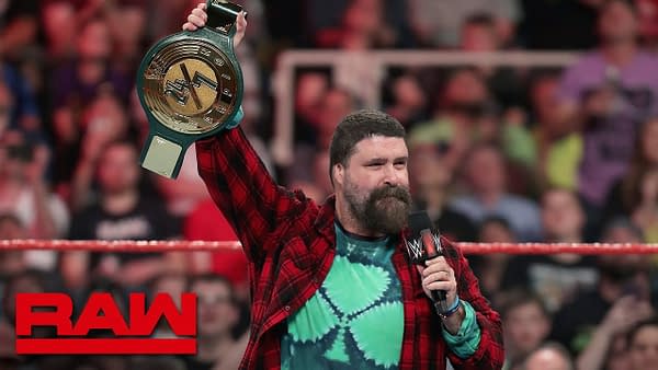 Mick Foley unveils the WWE 24/7 title, courtesy of WWE.