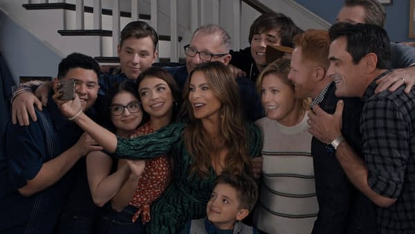 Phil, Mitch, Cam, Claire, Jay, Gloria, and the rest of the family gather for another group hug selfie on Modern Family, courtesy of ABC.