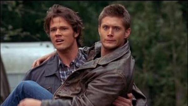 Jensen Ackles and Jared Padalecki clowing around on the Supernatural set, courtesy of The CW.