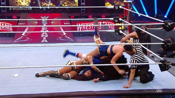 Tamina is pinned by Bayley, Sasha Banks, Naomi, and Lacey Evans at WrestleMania 36.