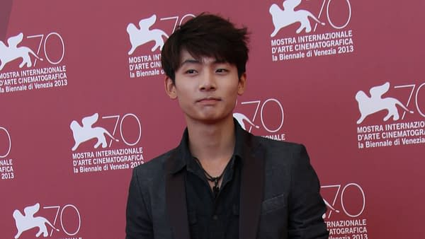 Haruma Miura poses at the photocall for 'Harlock: Space Pirate' during the 70th Venice Film Festival, in front of a pink backdrop featuring festival logos.