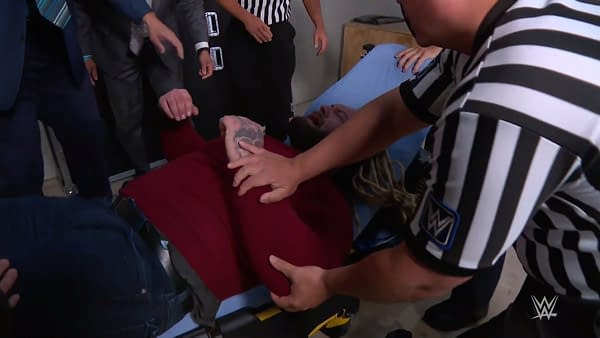 Bray Wyatt is loaded into an ambulance after an attack by Braun Strowman ahead of their SummerSlam match.