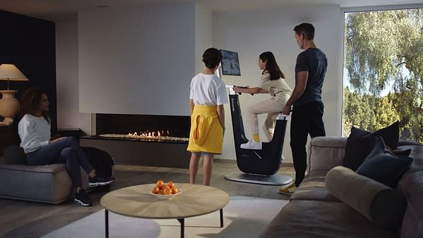 A promotional image of the Playpulse ONE in action at home in the living room.
