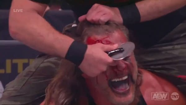 Nick Gage slices up the forehead of Chris Jericho right before AEW Dynamite cuts to a commercial for Domino's Pizza.