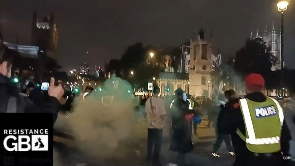 V For Vendetta-Masked Protestors Firework Clash With Police In London