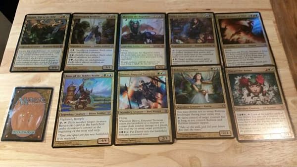 A set of oversized Magic: The Gathering cards for the Commander format, found listed on an online auction website.