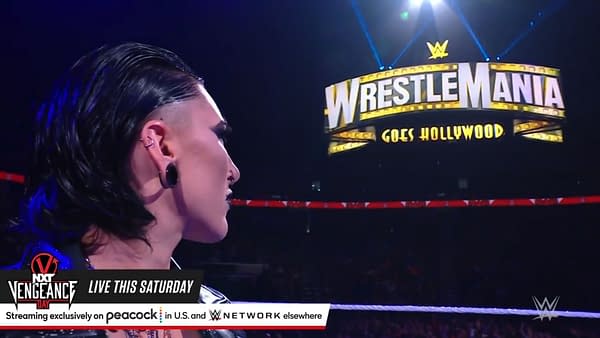 Royal Rumble winner Rhea Ripley gazes at the WrestleMania sign after challenging Charlotte Flair on WWE Raw