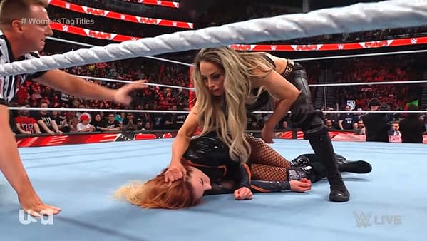Trish Stratus attacks Becky Lynch on WWE Raw after losing the tag team titles.