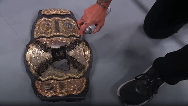 CM Punk paints the Twitter logo on his AEW Championship on AEW Collision