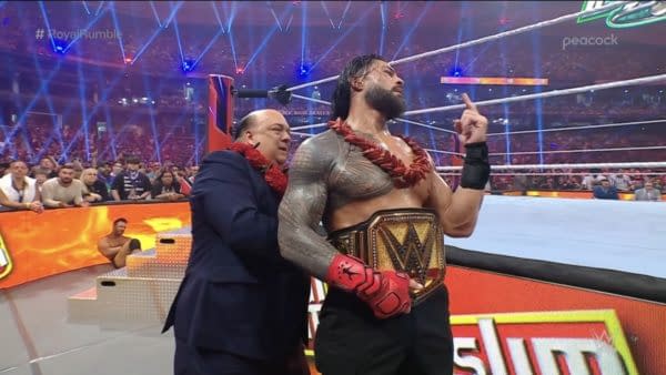Roman Reigns stands victorious with Paul Heyman at the WWE Royal Rumble