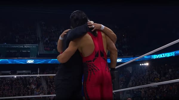 Sting hugs his sons, Garrett and Steven Borden, following his retirement match at AEW Revolution