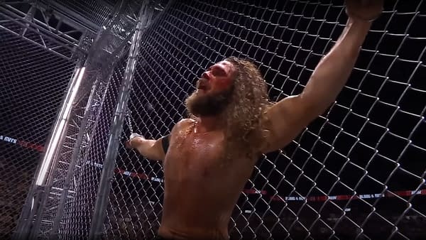 Jack Perry is handcuffed to the cage at AEW Dynamite: Blood & Guts