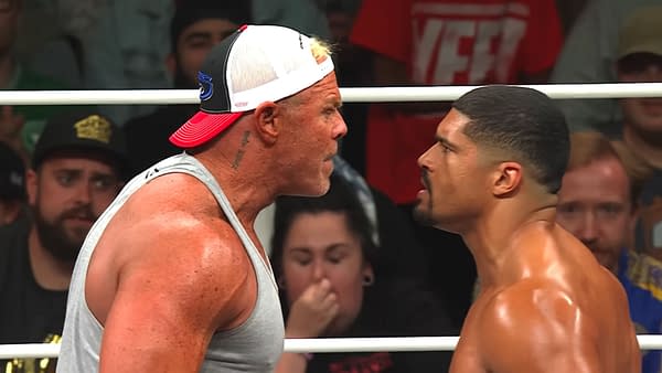 Billy Gunn yells intensely at Anthony Bowens in a wrestling ring during AEW Collision, highlighting a tense confrontation between the two wrestlers.
