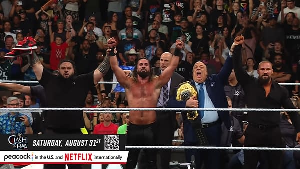 Seth Rollins and his friends celebrate in the wrestling ring after WWE Raw, with the crowd cheering in the background.