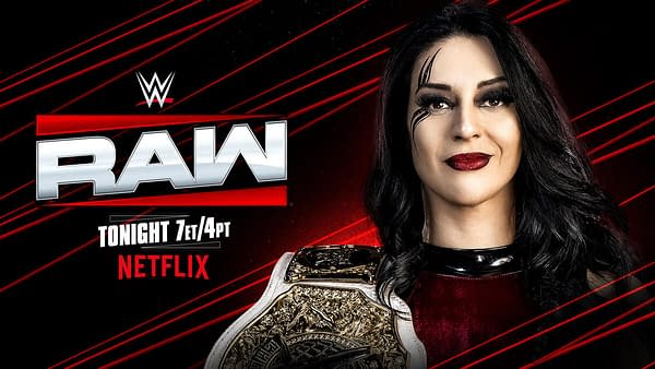 A woman with long black hair and dramatic makeup smiles confidently while holding a wrestling championship belt. The background features the WWE Raw logo with red and black accents.