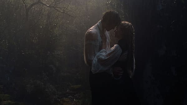 A romantic scene from "Wuthering Heights", depicting a couple in a close embrace amidst a misty, wooded area with rain falling around them, evoking passion and intensity.