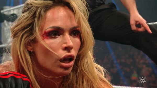 Maxxine Dupri shows a shocked expression, revealing dramatic makeup with red stars around her eyes, reflecting a moment of betrayal during WWE Raw.