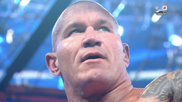 A close-up of Randy Orton celebrating after winning the Elimination Chamber match, with visible excitement on his face, as he anticipates the chance to become a 15-time world champion.