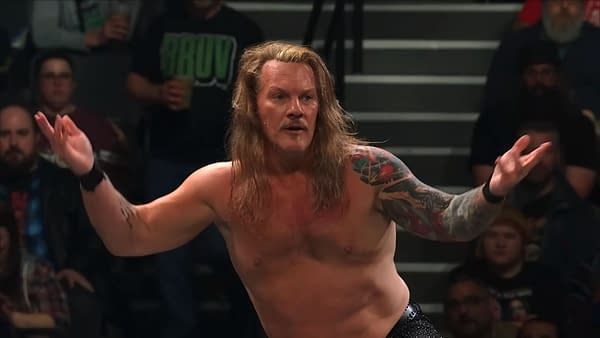 Chris Jericho stands in the AEW ring with his arms out and a puzzled expression, seeming to weigh his next move on Collision.