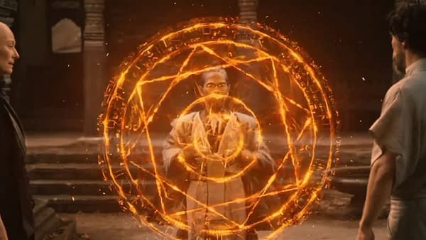 Doctor Strange's Master Hamir stands inside a glowing orange magical shield, facing two other figures in a temple-like setting.