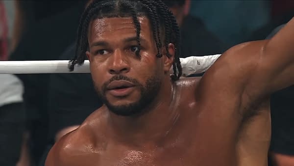 Kevin Knights leans against the ropes in the AEW ring, looking winded and concerned after MJF's latest outburst on Dynamite.