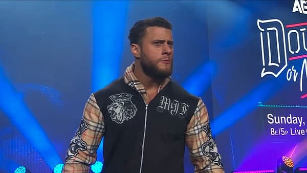 MJF stands on the AEW Dynamite stage with a confused, frustrated expression, reacting to Darby Allin refusing him a rematch.