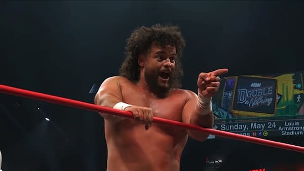 Juice Robinson points emphatically from inside the AEW ring during Collision, with a Double or Nothing sign in the background.