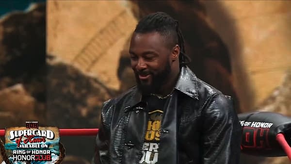 Swerve Strickland stands in a wrestling ring at ROH Supercard of Honor, wearing a black leather jacket and smiling slightly. A Ring of Honor promotional graphic appears in the corner.