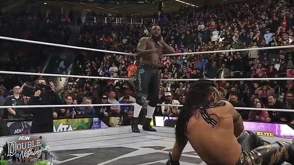 Swerve Strickland stands in the ring at AEW Double or Nothing, preparing to finish off Bandido as the crowd looks on.