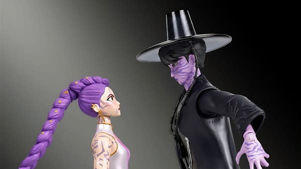 KPop Demon Hunters Rumi and Jinu figure 2-pack posed face to face, with Rumi's purple braid and Jinu's black hat and dark outfit. Their matching purple markings stand out against a plain background.