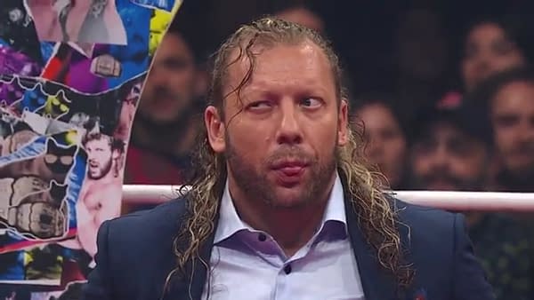 Kenny Omega is seen reacting to crowd cheers during a segment in the ring on AEW Dynamite