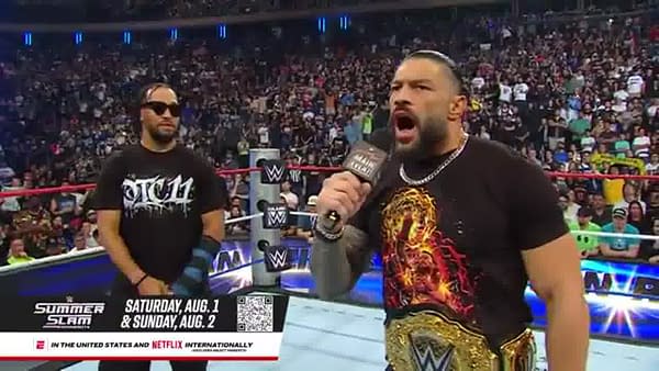 Roman Reigns addresses the crowd with Jalen Brunson at WWE Saturday Night's Main Event
