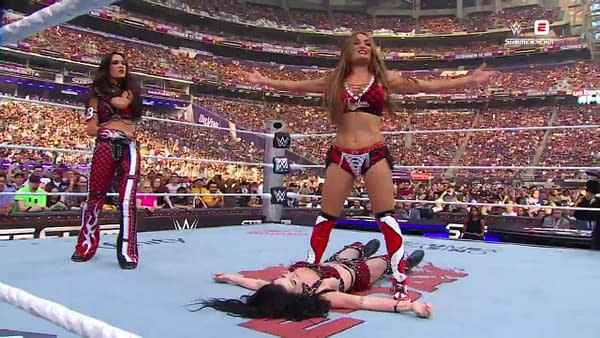 The Bellas stand triumphant over a destroyed Paige at WWE SummerSlam