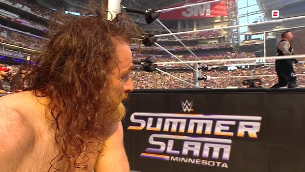 A dejected Sami Zayn watches with jealousy after losing at WWE SummerSlam