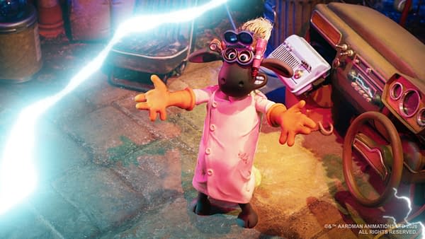 Shaun the Sheep stands in a lab coat and scientist goggles with his arms outstretched as bright lightning crackles across the laboratory.