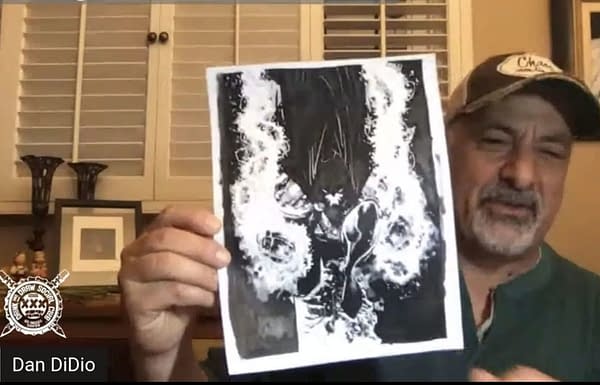 Dan DiDio shows off his artwork - or at least his sharpie inking.