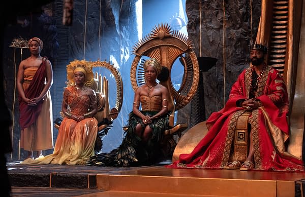 Children of Blood and Bone cast members sit on ornate thrones in elaborate royal costumes inside a dramatic fantasy set.
