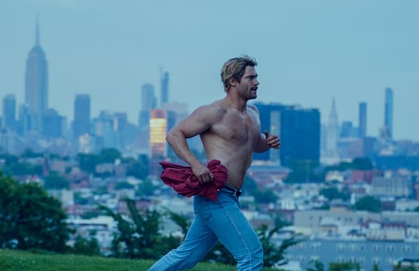 David Corenswet runs shirtless across a hill with the city skyline in the background in Mr. Irrelevant.