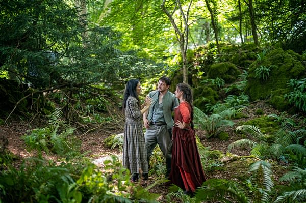 Chloé Zhao directs actors Paul Mescal and Jessie Buckley on the set of the film 'Hamnet' in a lush forest scene, surrounded by vibrant greenery and ferns.