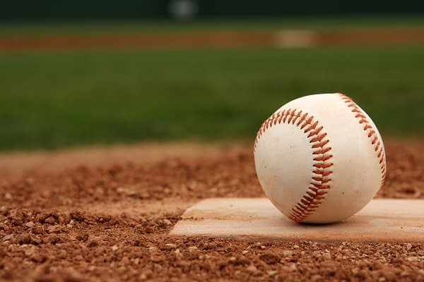 Baseball on Home Plate -- David Lee/Shutterstock.com