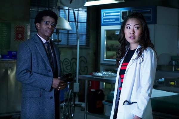 Batwoman -- "Off With Her Head" -- Image Number: BWN115a_0042b -- Pictured (L-R): Camrus Johnson as Luke Fox and Nicole Kang as Mary Hamilton -- Photo: Shane Harvey/The CW -- © 2020 The CW Network, LLC. All rights reserved.